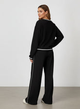 Vector Sportswear wide-leg lounge trousers with breathable fabric, elastic waistband, and versatile design.
